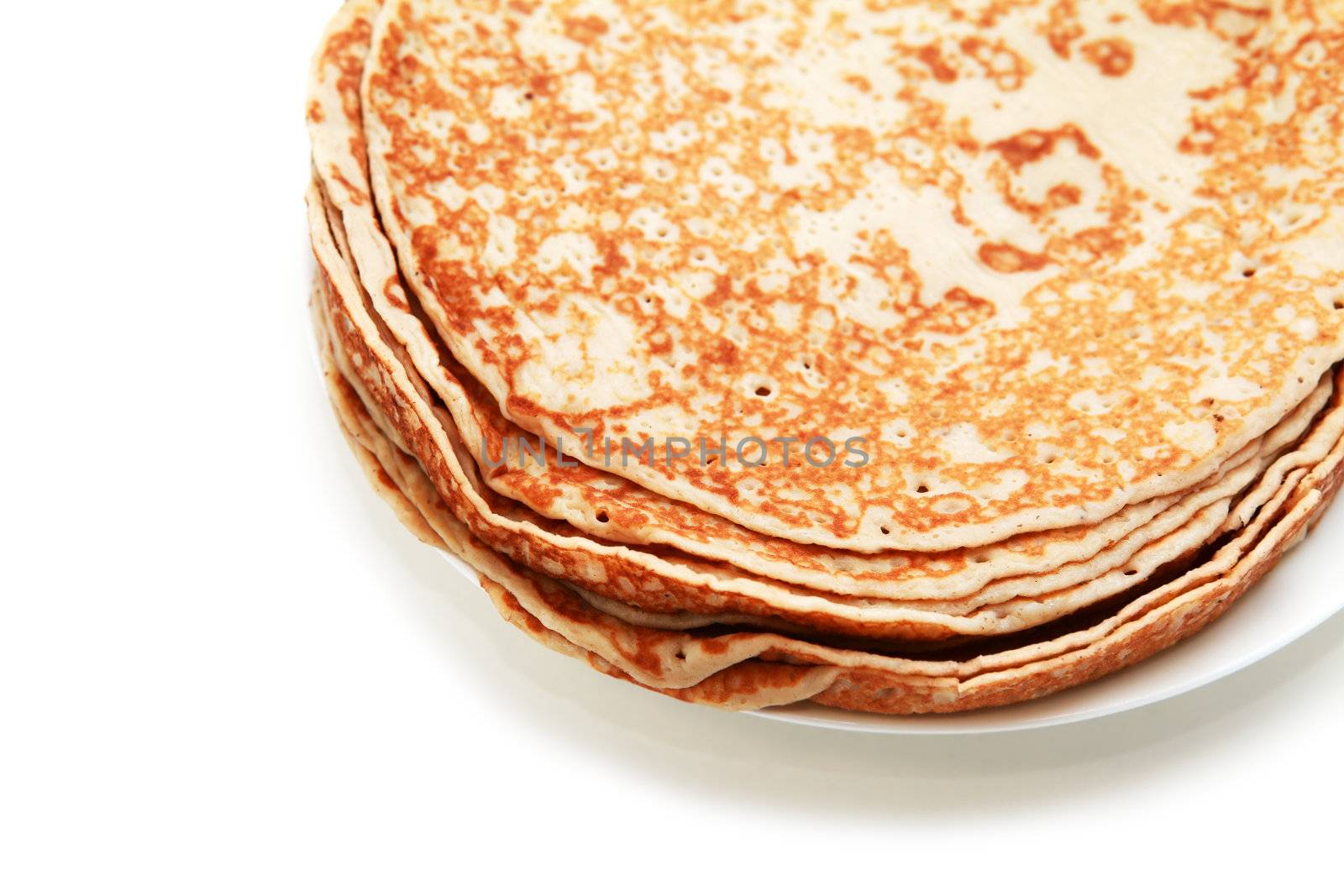 a few pancakes on plate on white background