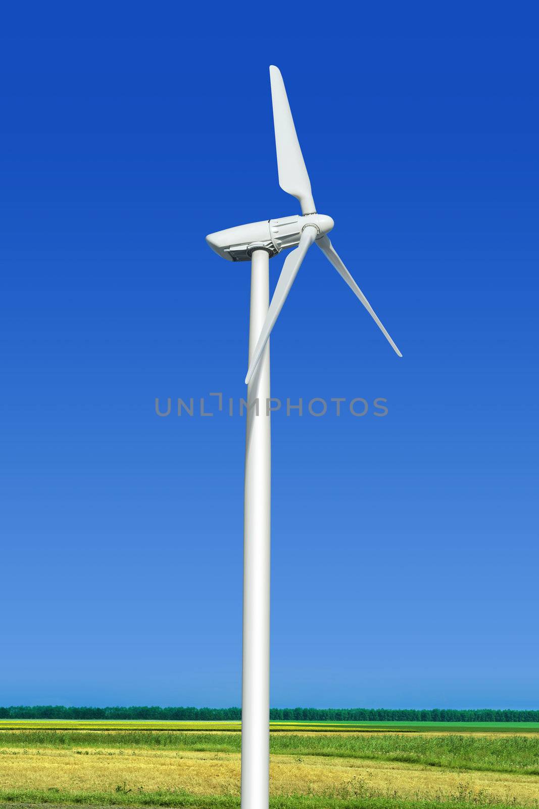 Beautiful green meadow with wind turbine generating electricity