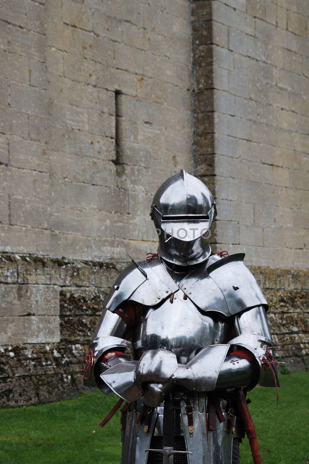 Knight in armour in front of castle