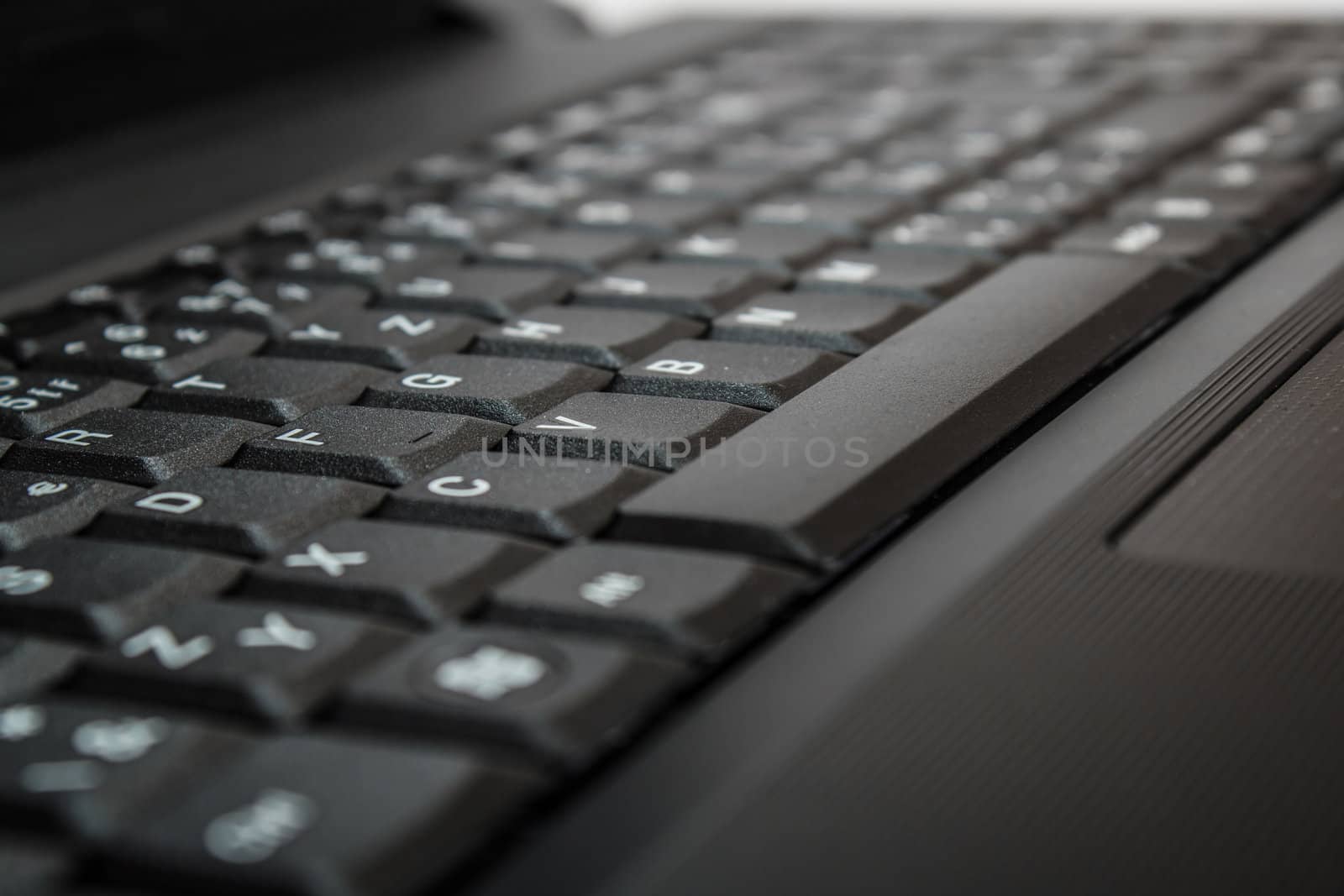 close up of toned laptop keyboard as a background