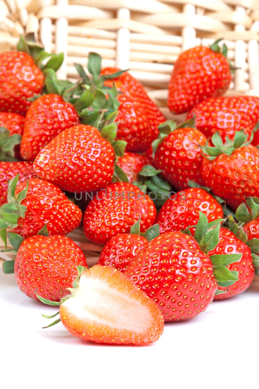 many strawberry falling out from a basket