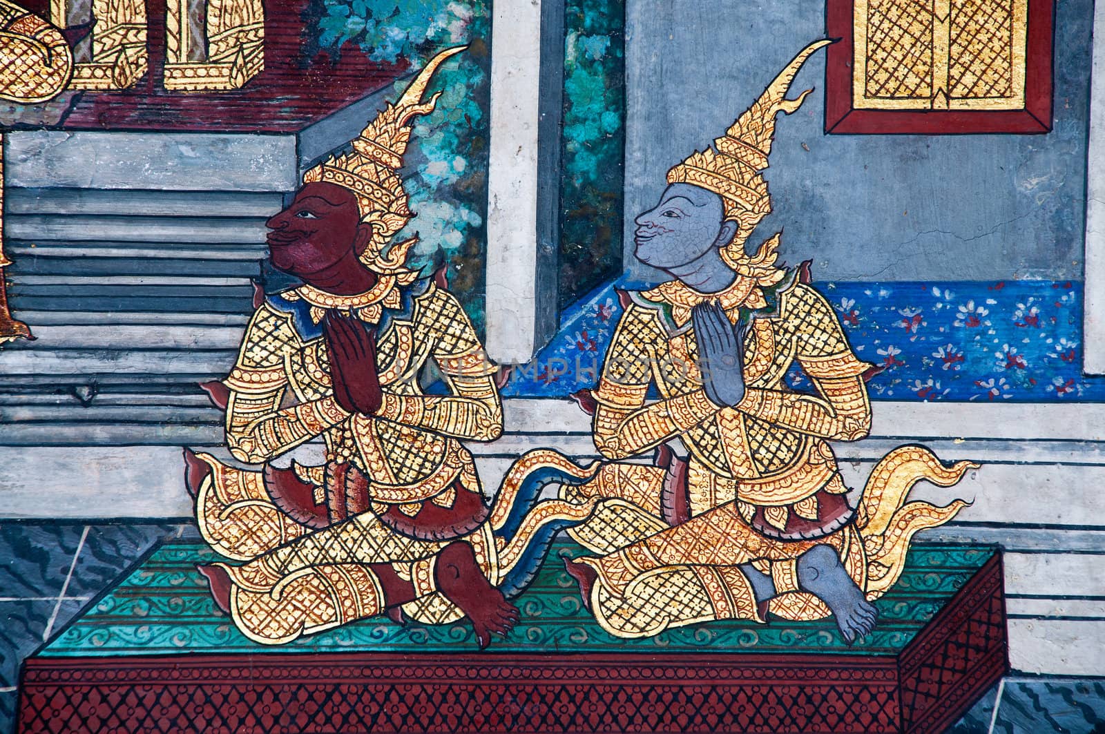 Thai Mural Painting on the wall, Wat Phra Kaew, Bangkok, Thailand (Ramayana story). The temple is created with money donated by people it is public domain and open to the public Visits.