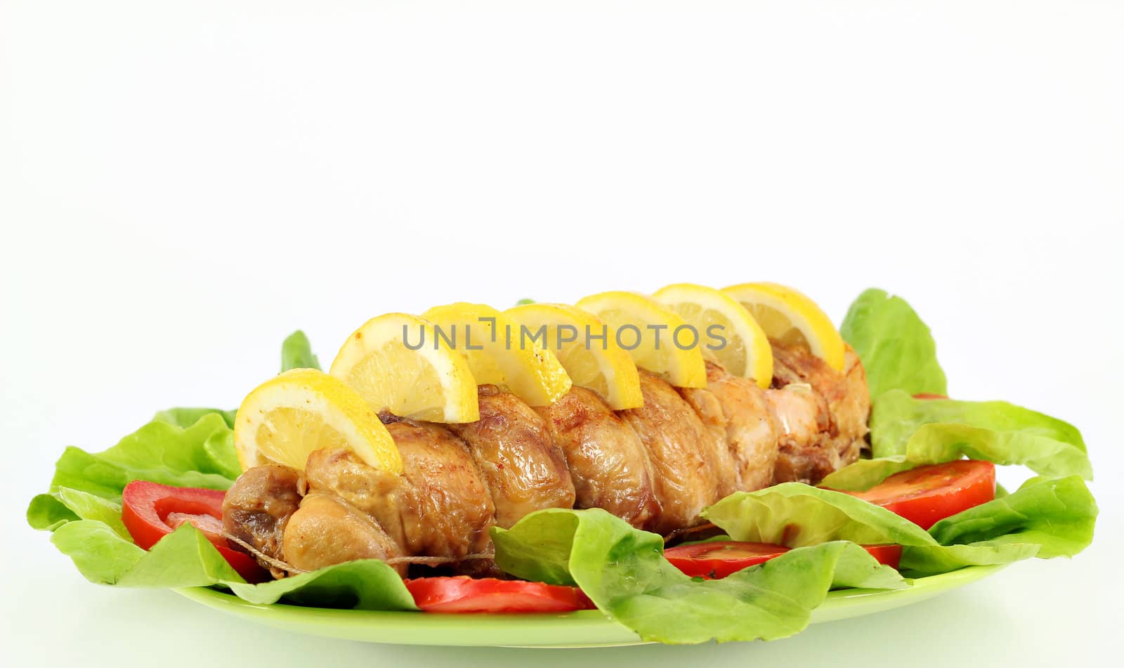 chicken meat with lemon and salad