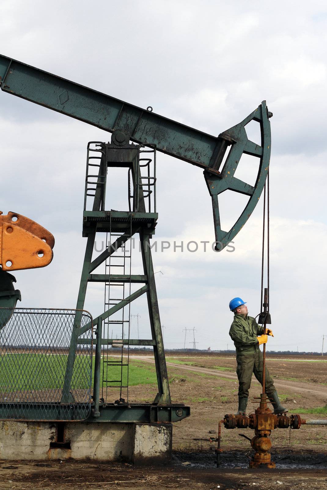 oil worker check pumpjack