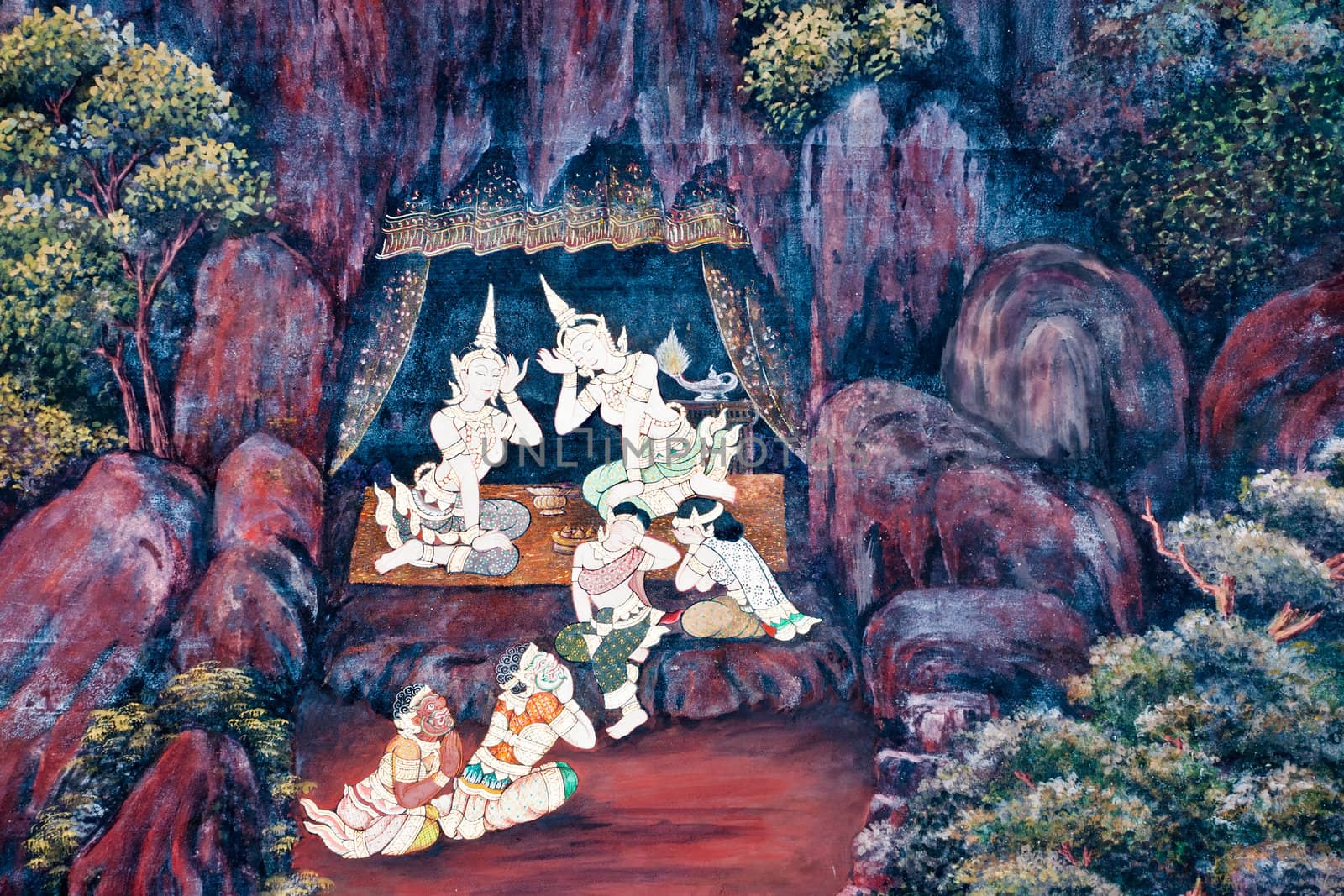 Thai Mural Painting on the wall, Wat Phra Kaew, Bangkok, Thailand (Ramayana story). The temple is created with money donated by people it is public domain and open to the public Visits.