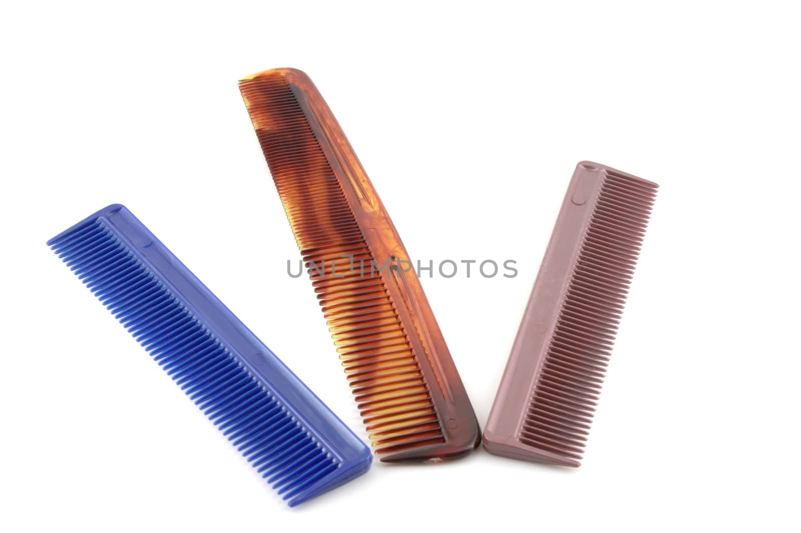 Plastic color combs over white