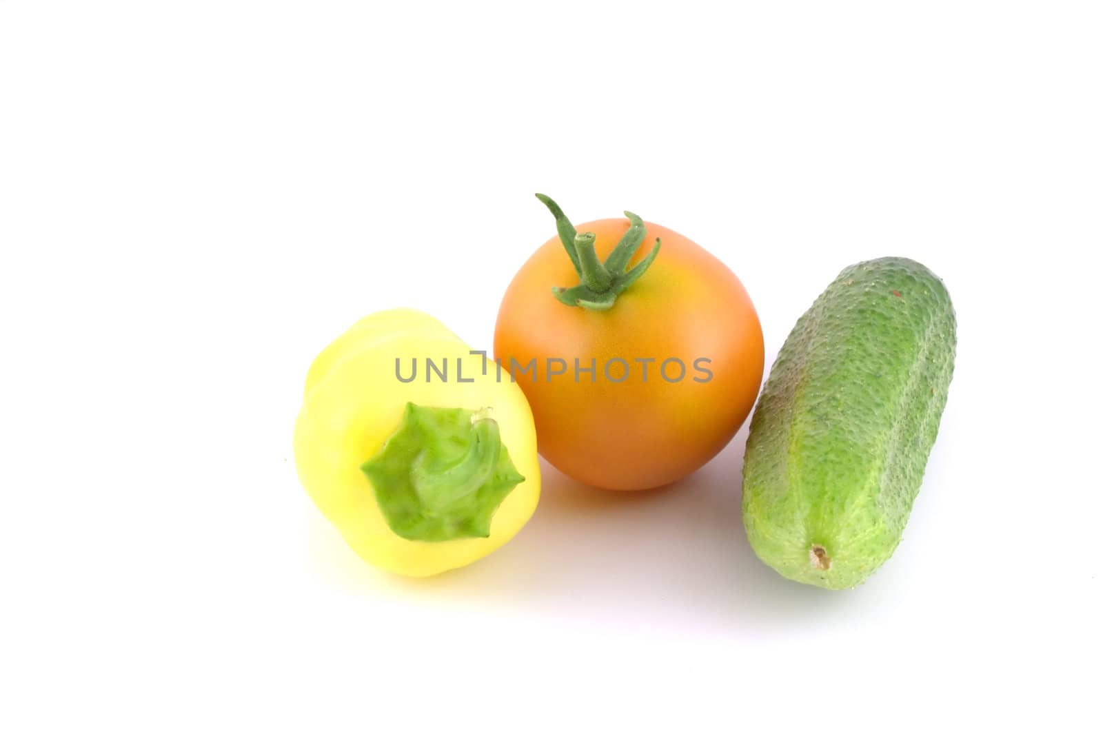 Cucumber, tomato and pepper over white