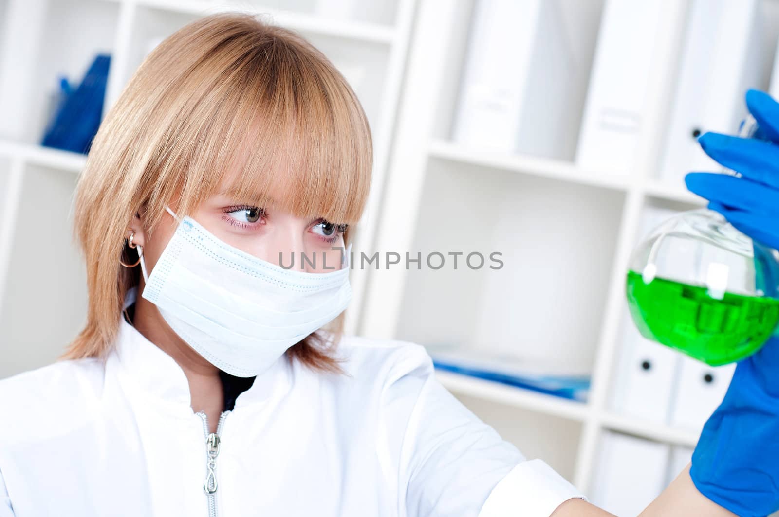 chemist working in the laboratory, mix liquid