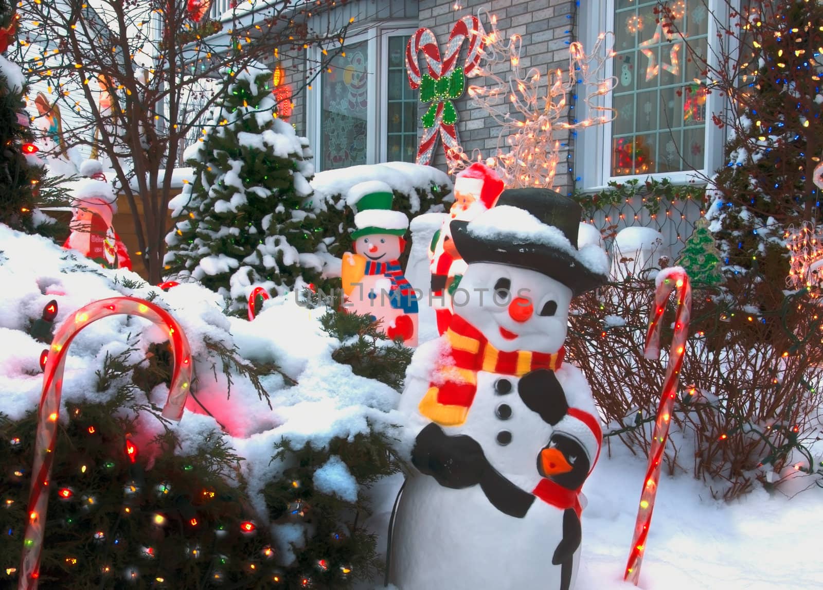 A home near the North Pole is decorated for Christmas with candy canes, sonowmen, lights and much more.