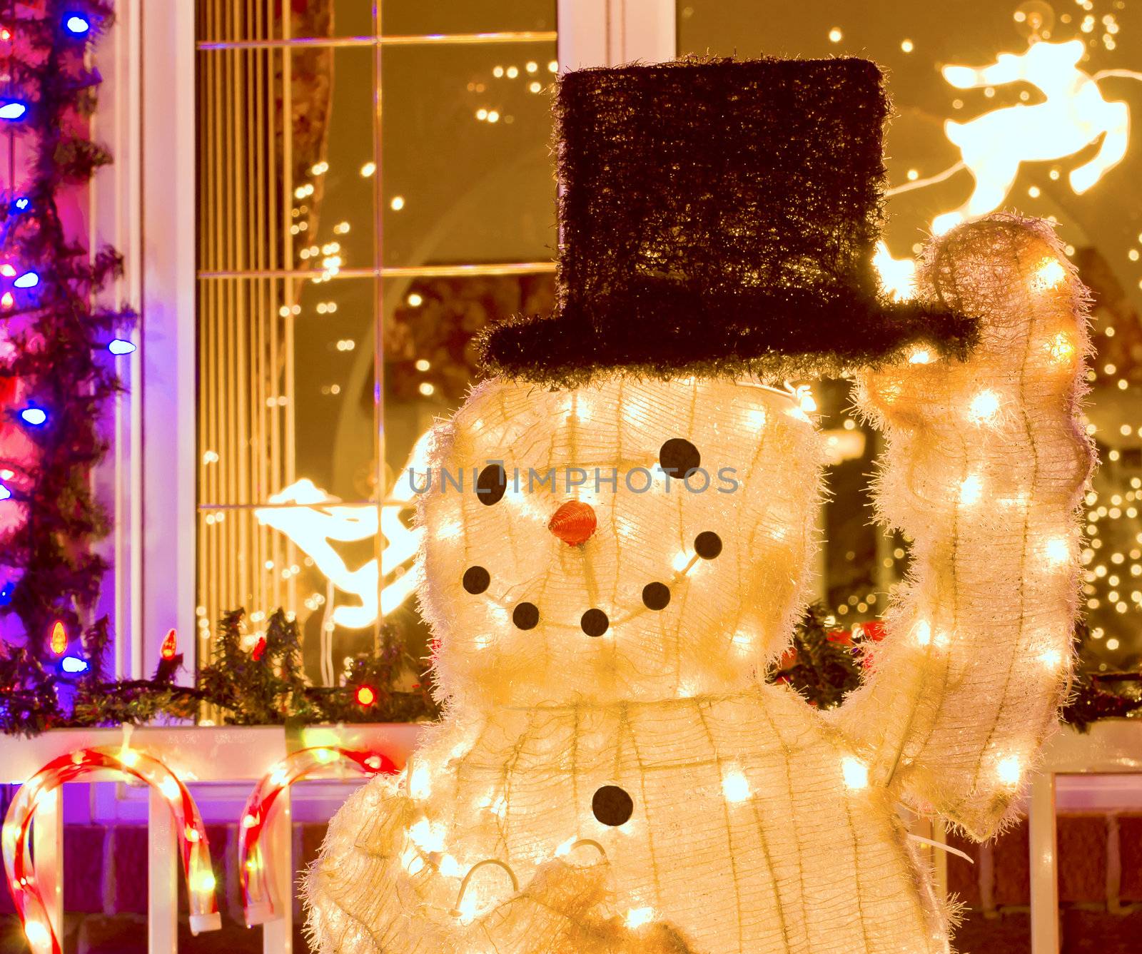 Snowman with top hat decorated for Christmas.