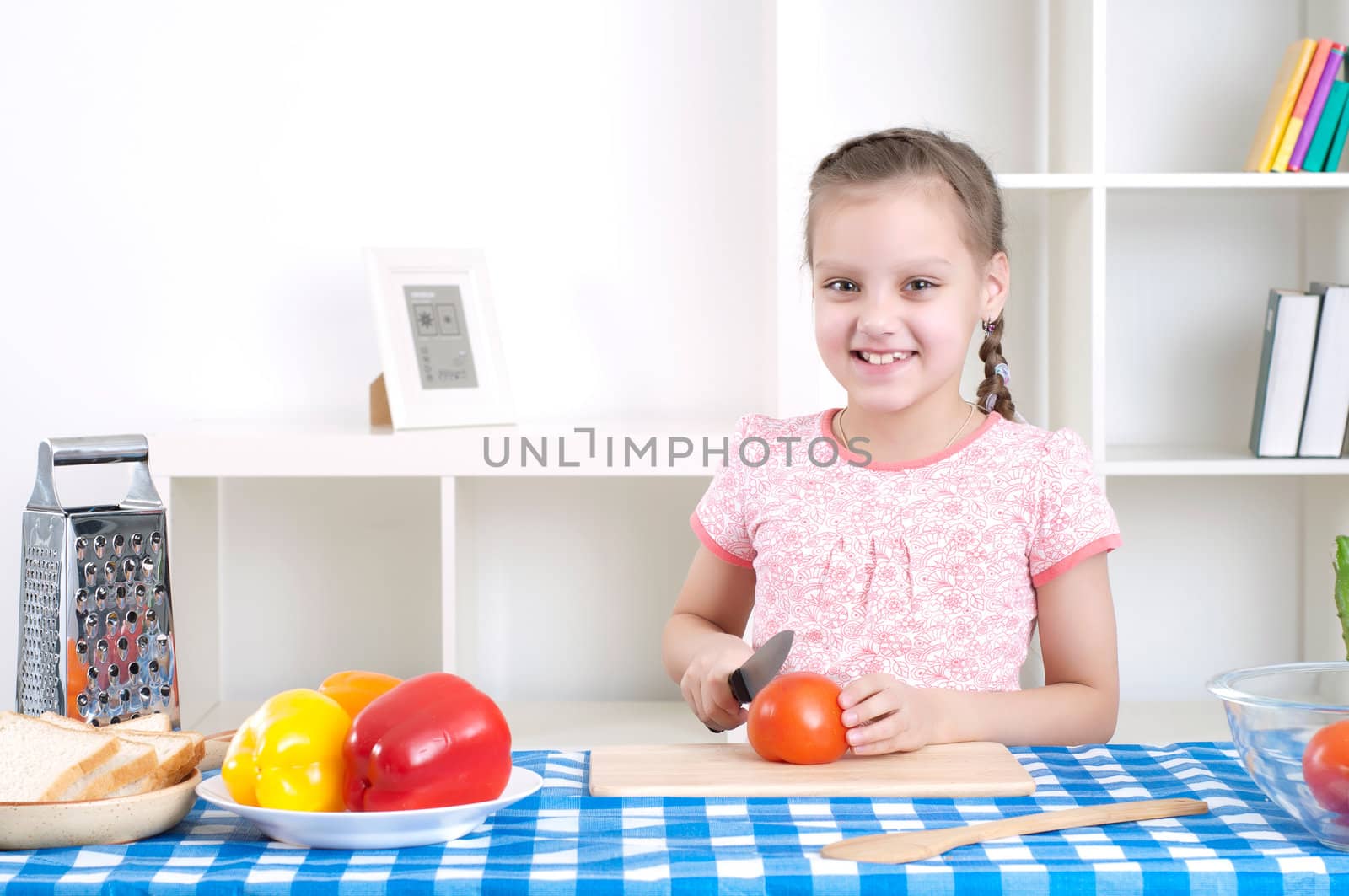 girl working in the kitchen cutting vegetables by adam121