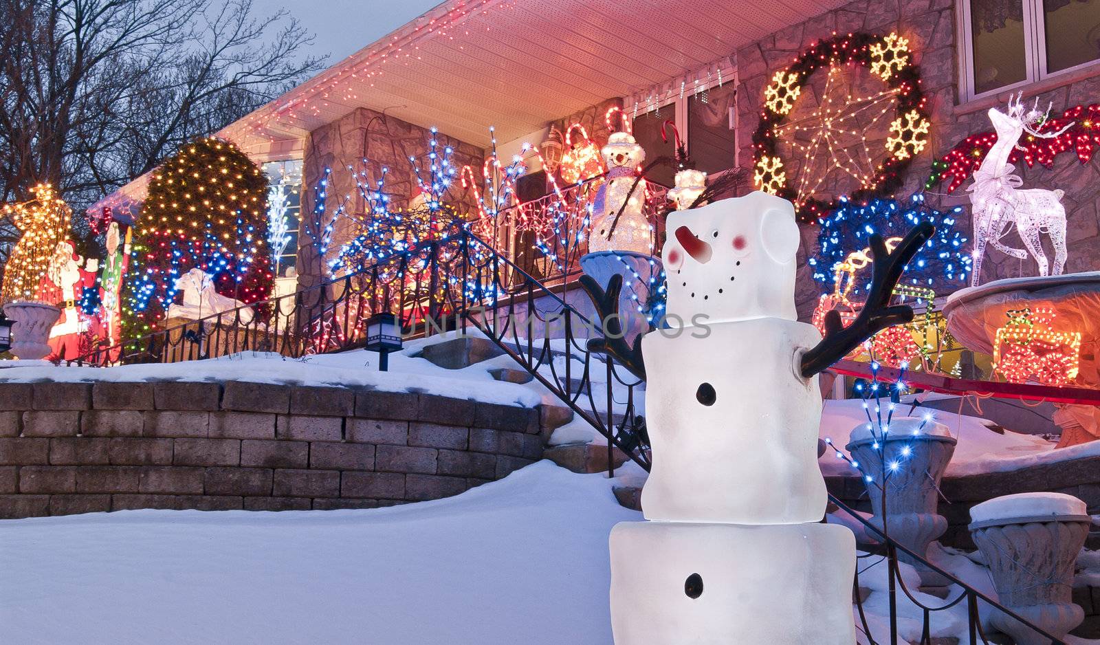 A bungalow is decorated for the Christmas Season with snowmen and much more.