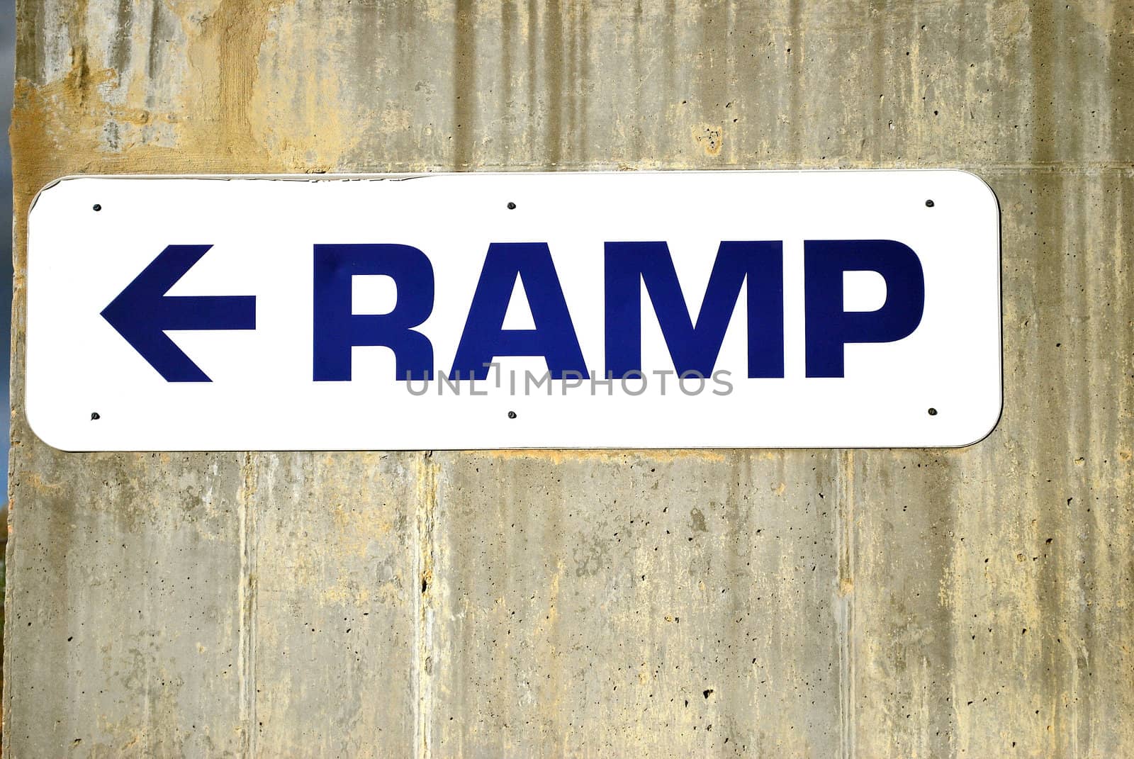 Ramp sign in front of a stadium.
