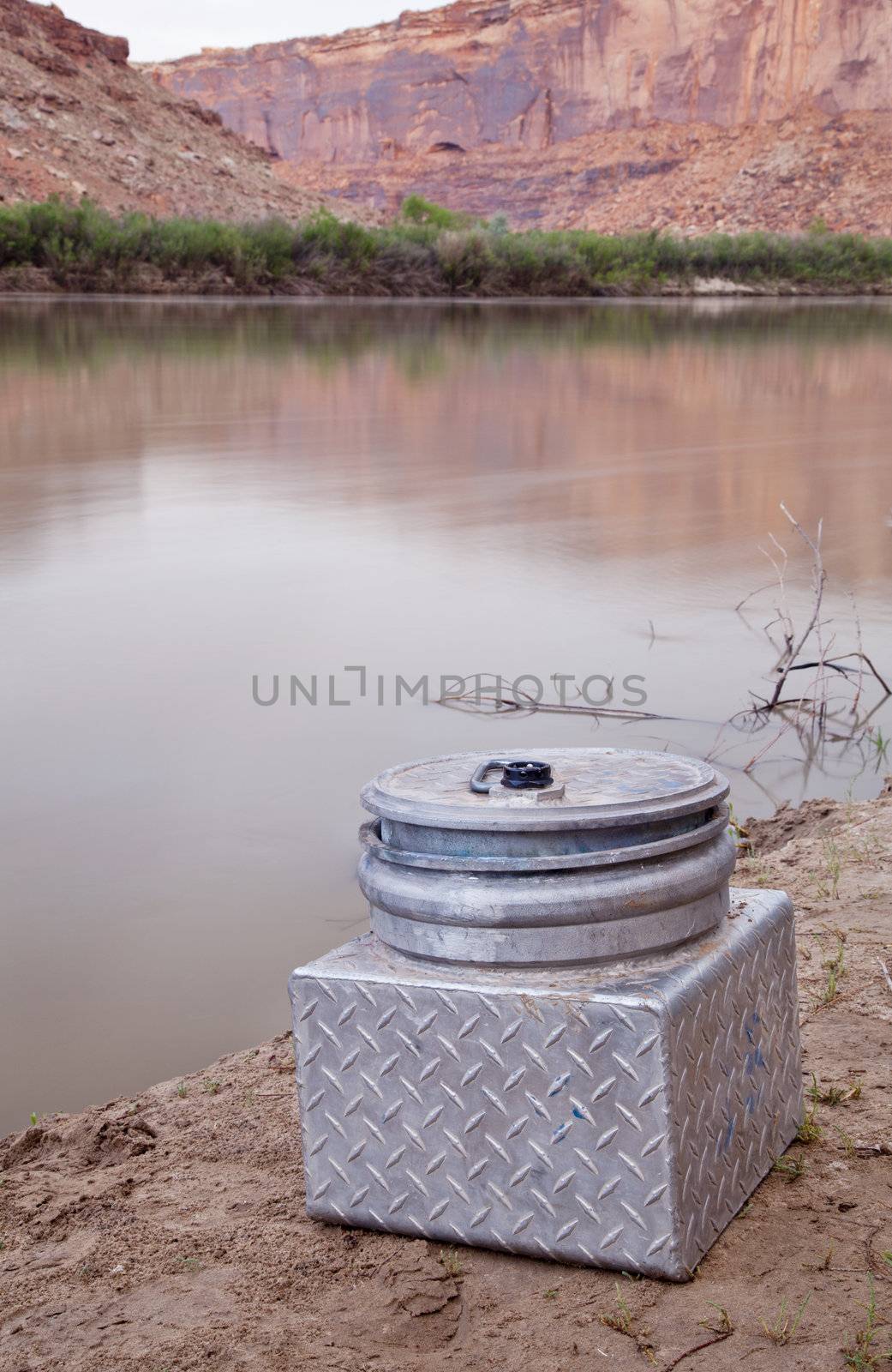 small metal portable toilet on a shore of Green River, equipment required on river trips in Canyonlands, Utah