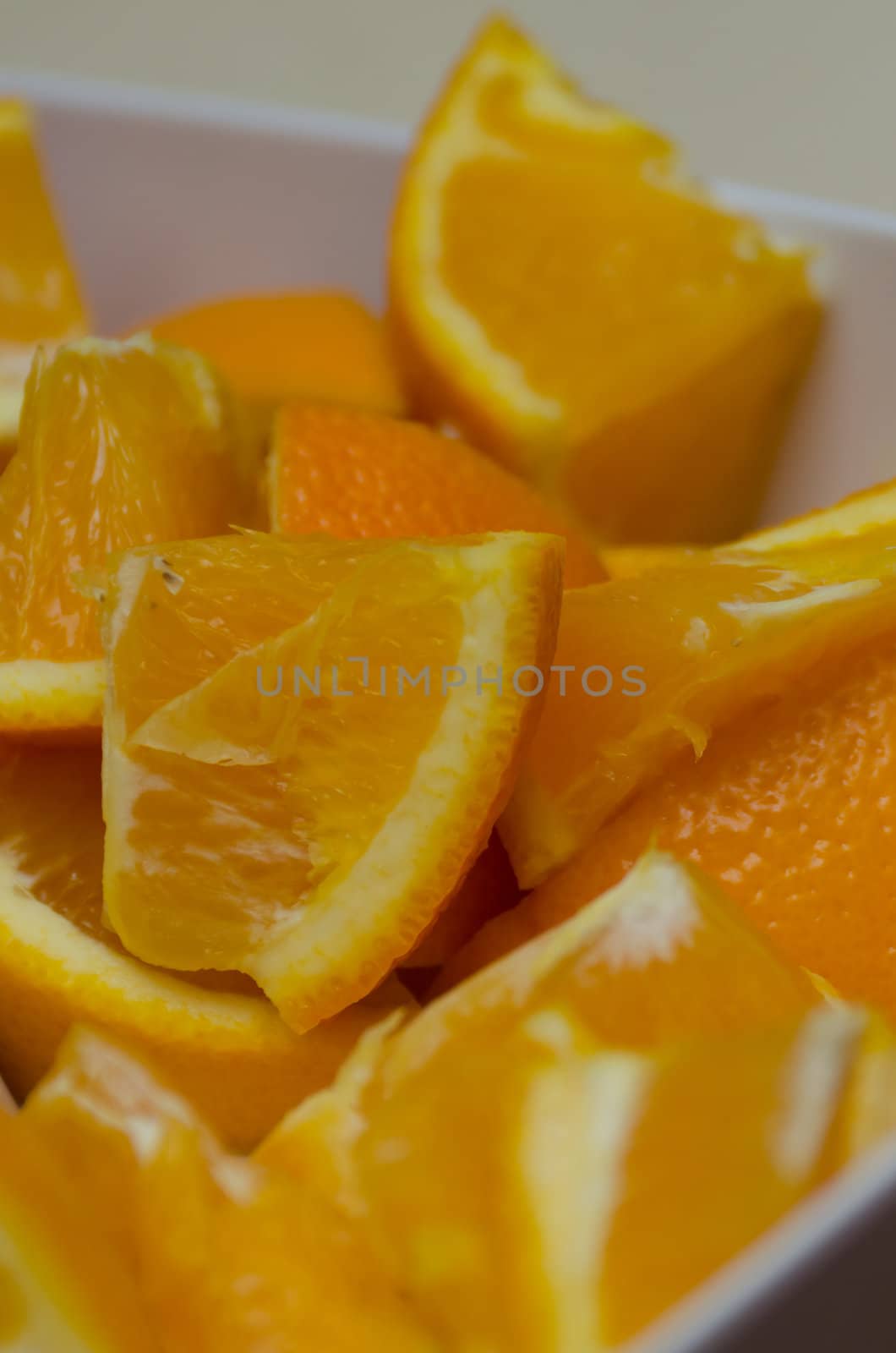 sliced oranges waiting to be eaten on a hot summers day