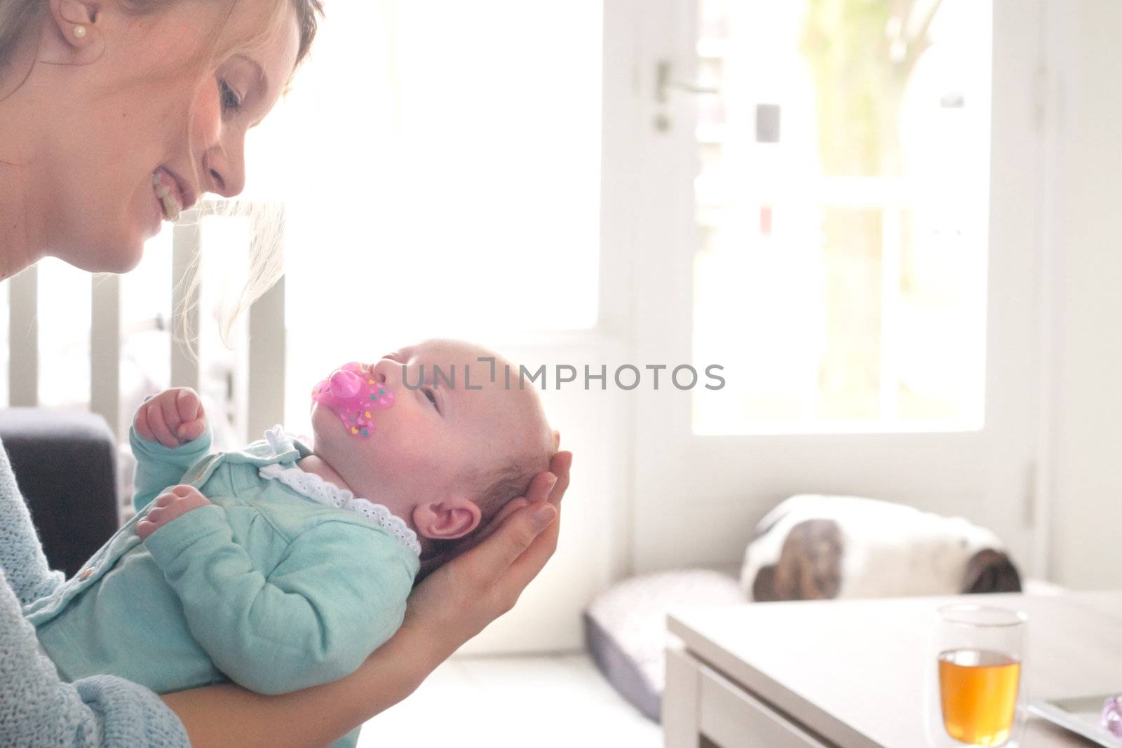 Happy young parents and their little baby