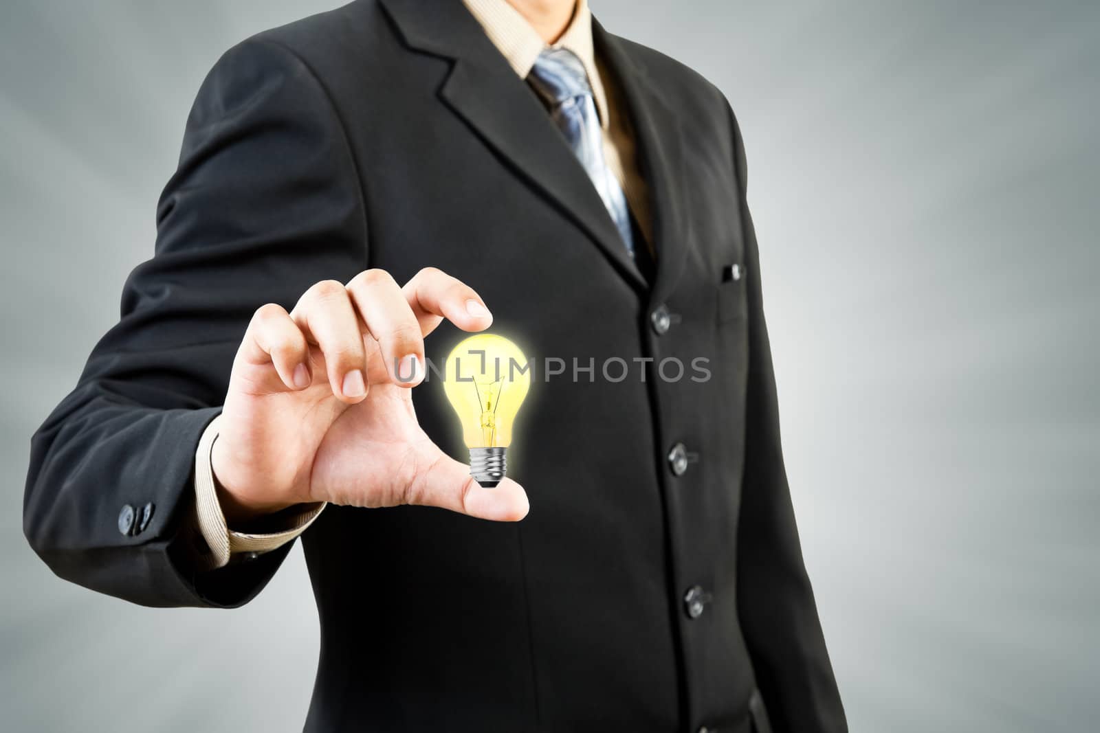 Light bulb in businessman hand