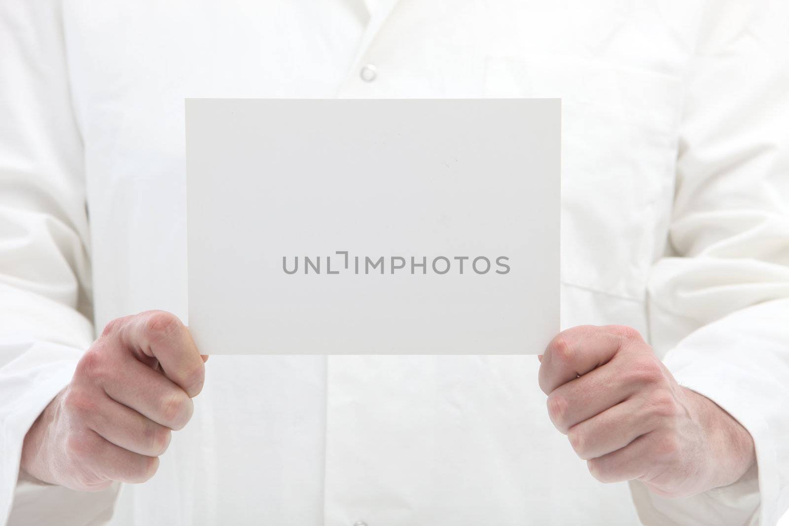 Man holding blank white card with space for your text or message in front of himself