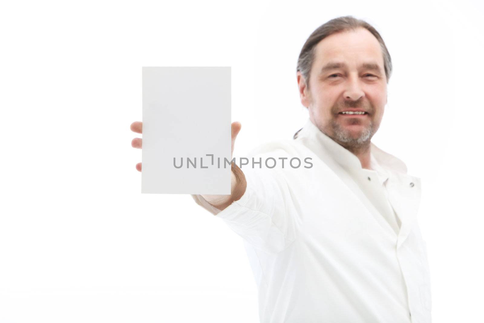 Mature man holding blank note isolated on white