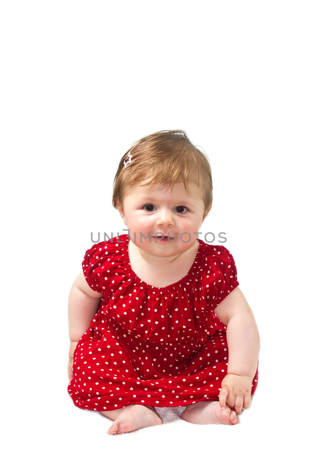 Happy baby sitting on white towel