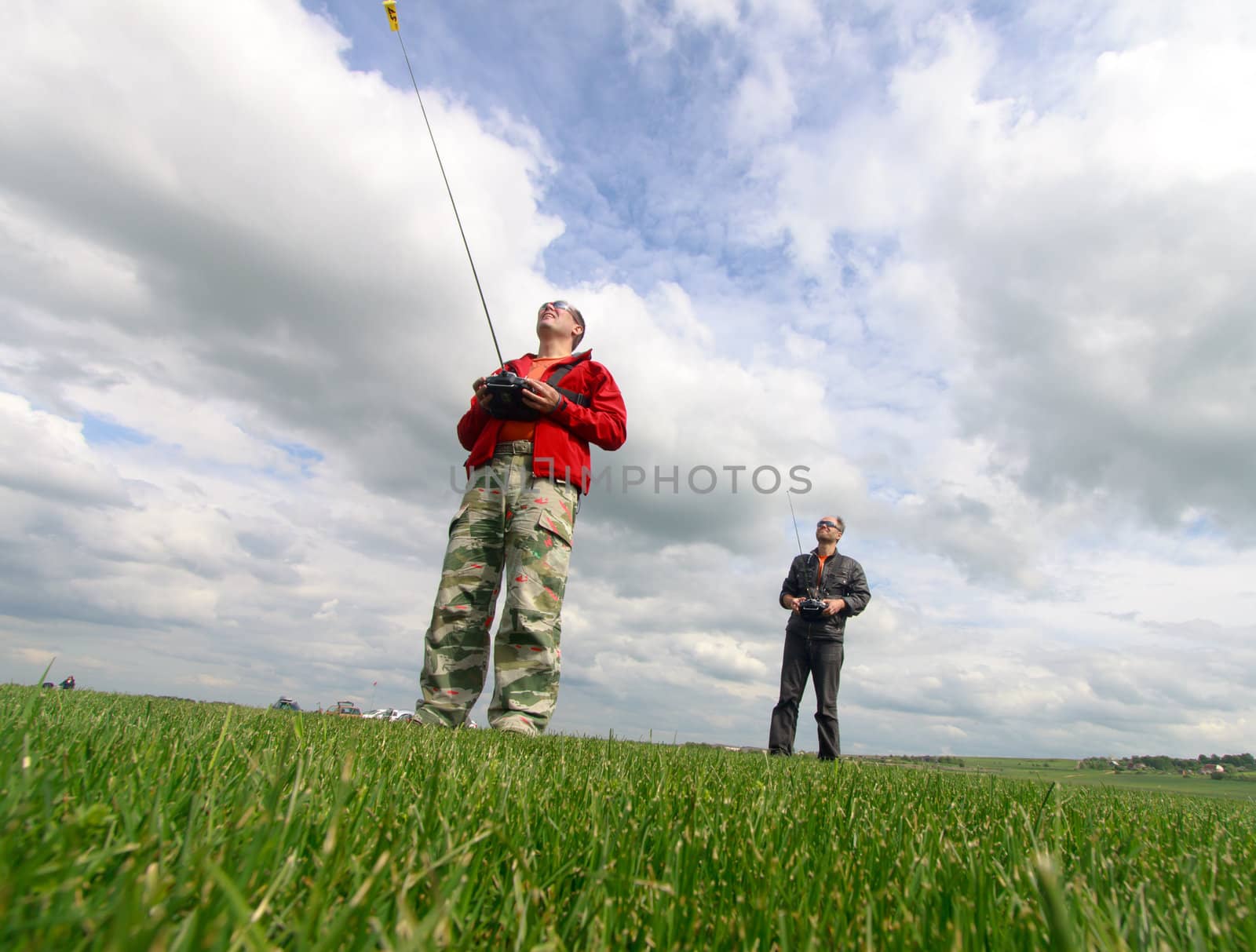 Two Man controls RC gliders in the sky