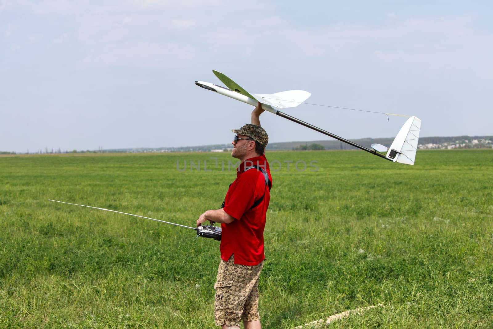 Man launches into the blue sky RC glider