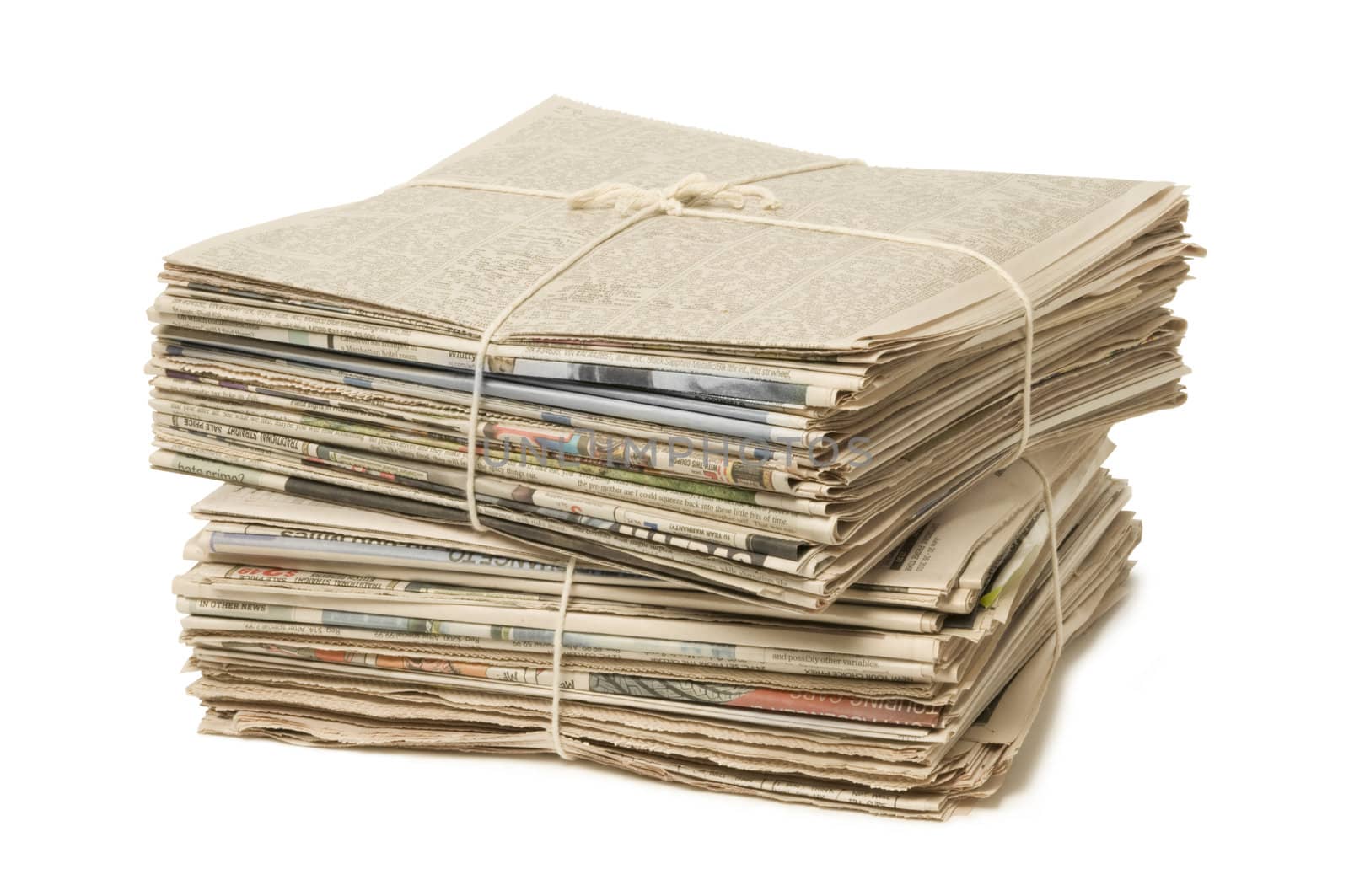 Stack of two newspaper bundles for recycling against white