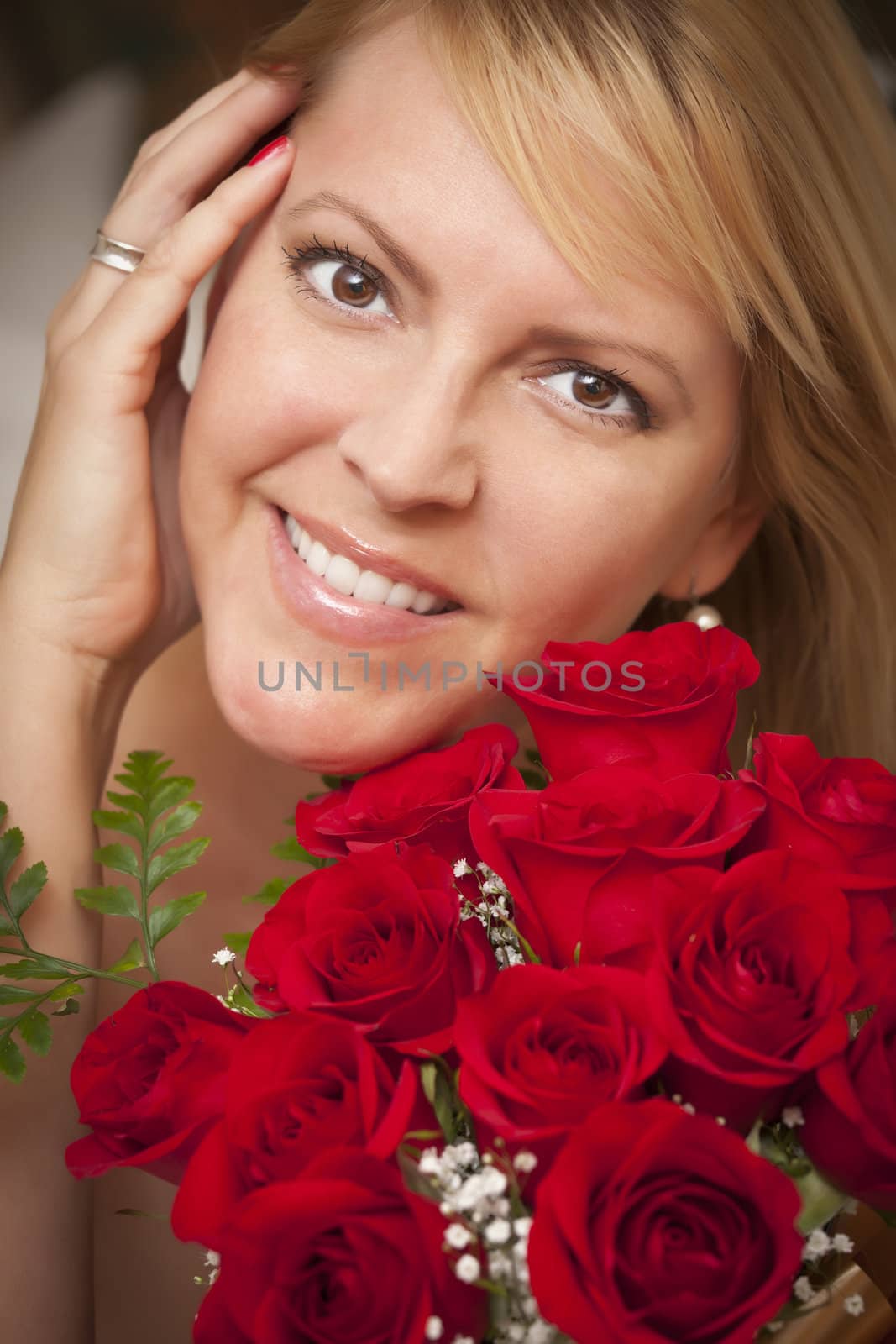 Beautiful Smiling Blonde Woman with Red Roses.