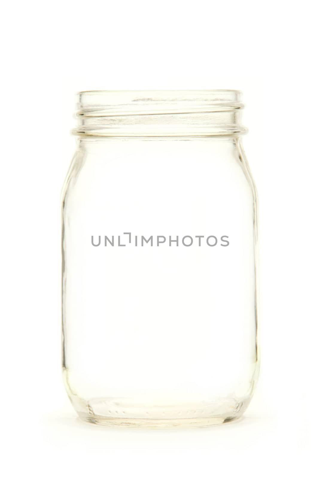 Empty glass jar isolated on white