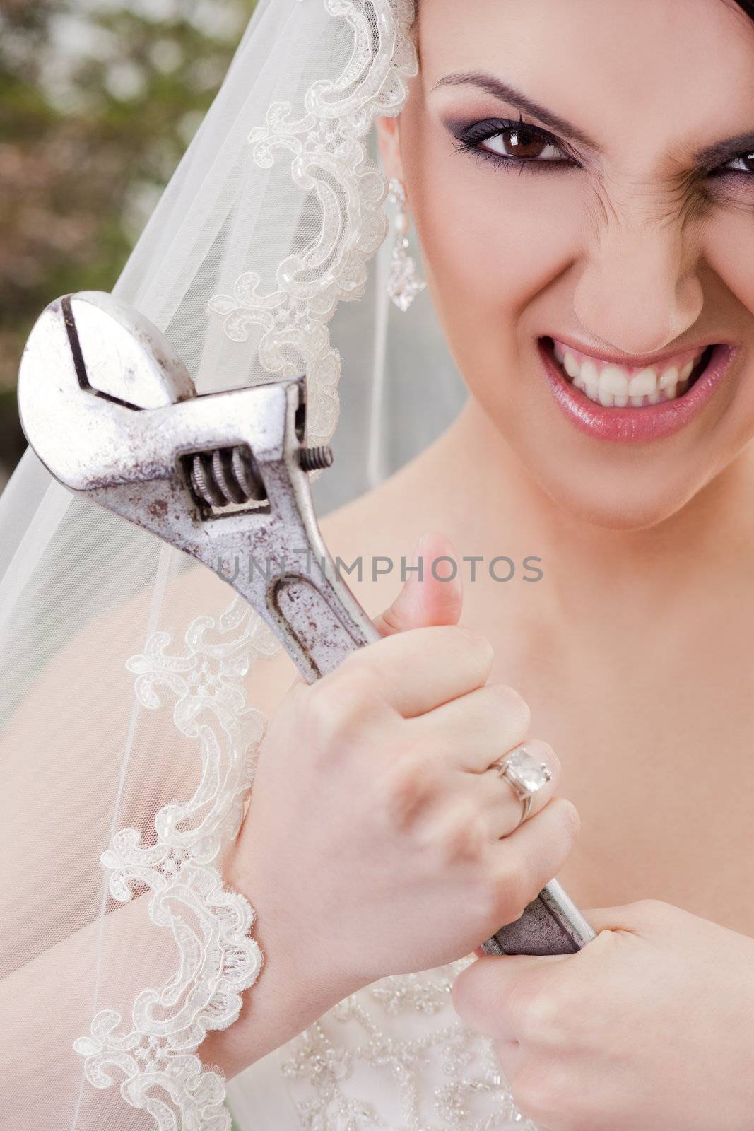 Furious bride holding wrench by vilevi