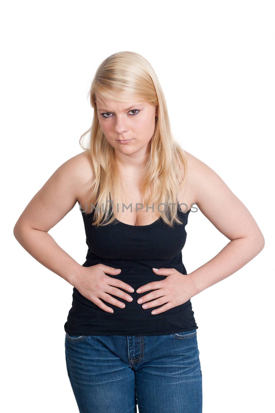 Young blonde woman with stomach ache holding her belly 