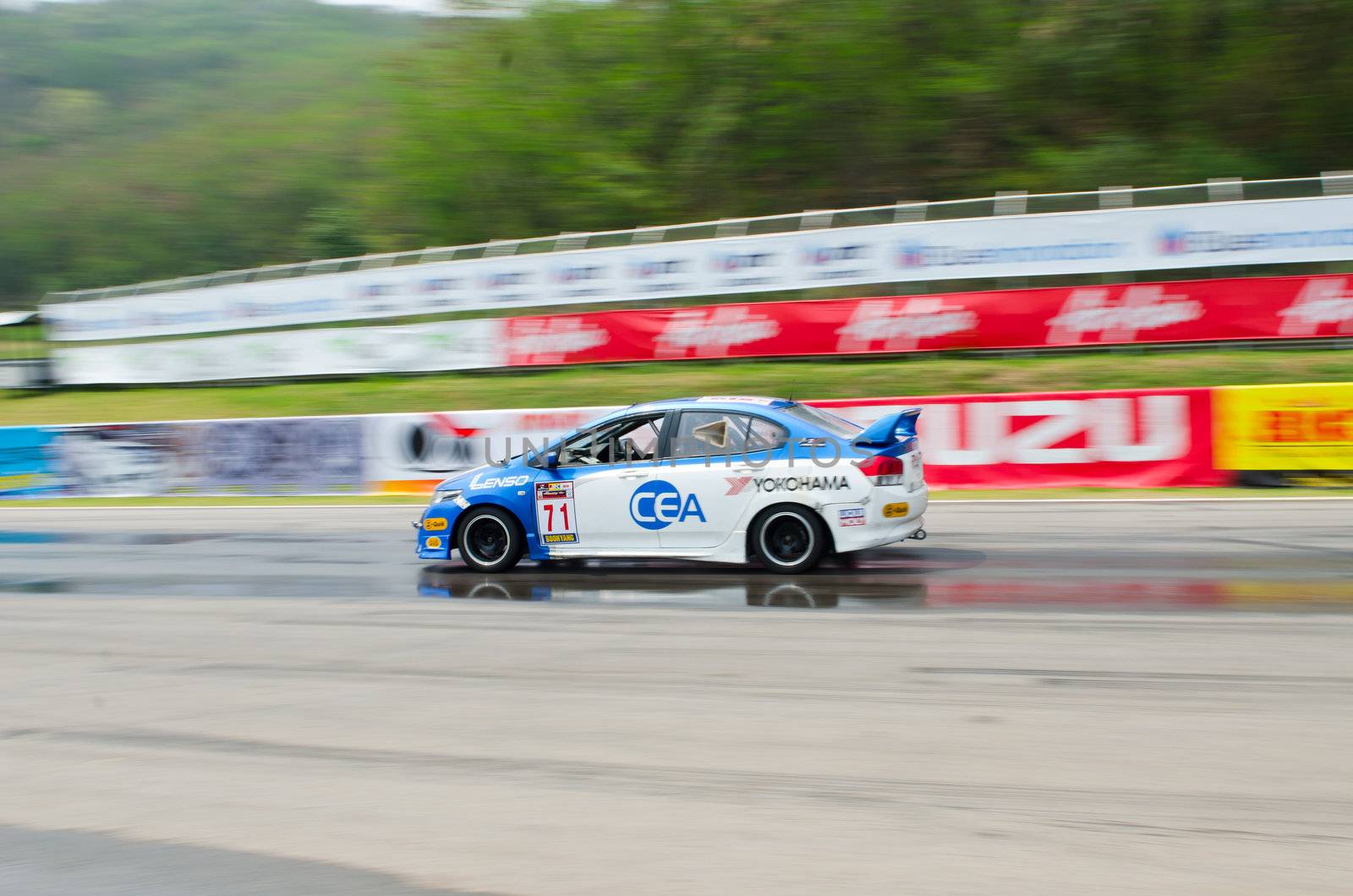 Nakhon Ratchasima, Thailand - March 9th:Unidentified car racing competitors during the "Thailand circuit 2013  " at Bonanza speedway on March 9th, 2013 in Nakhon Ratchasima, Thailand. 