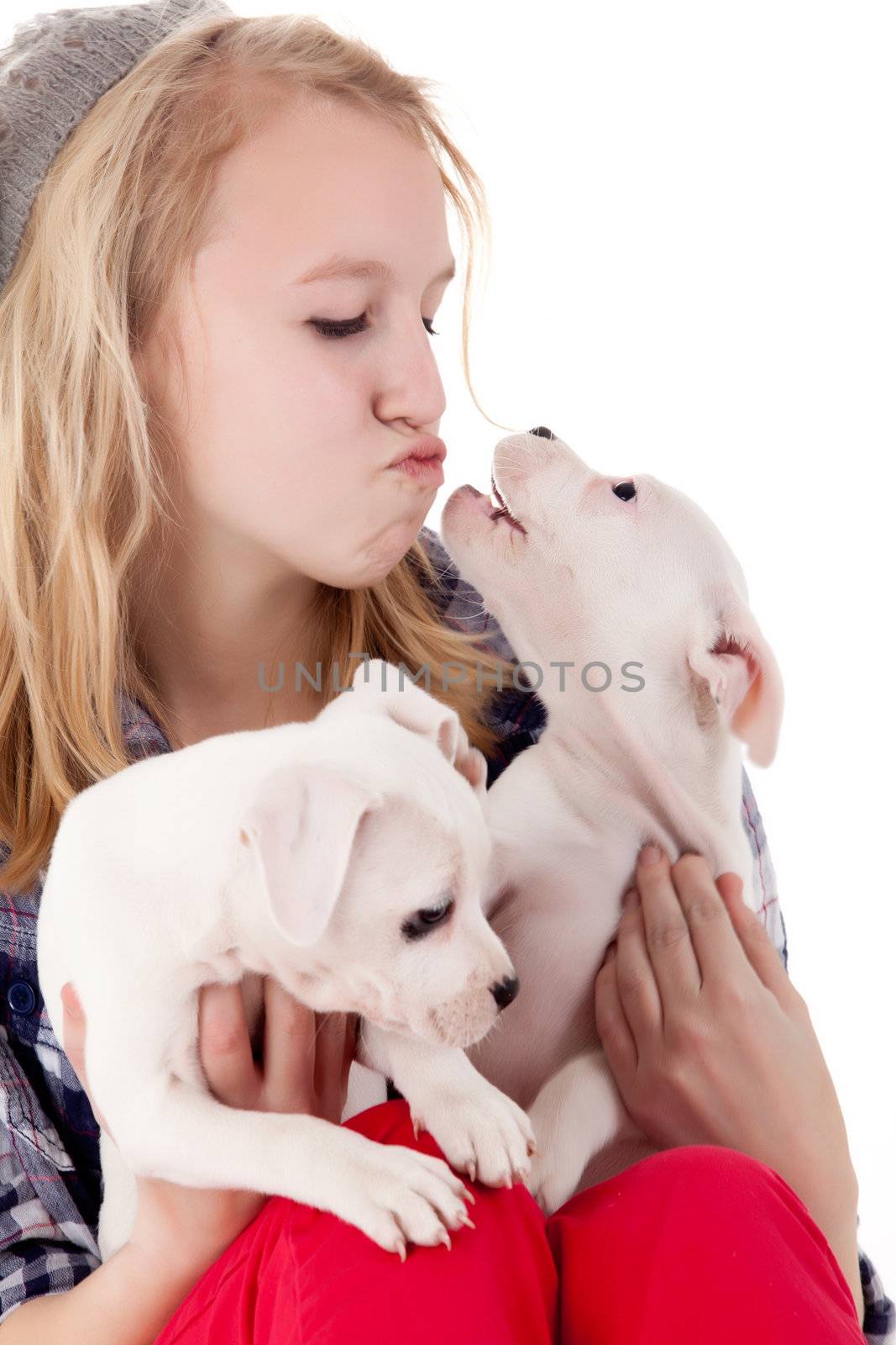 Young girl having a great time with the puppies