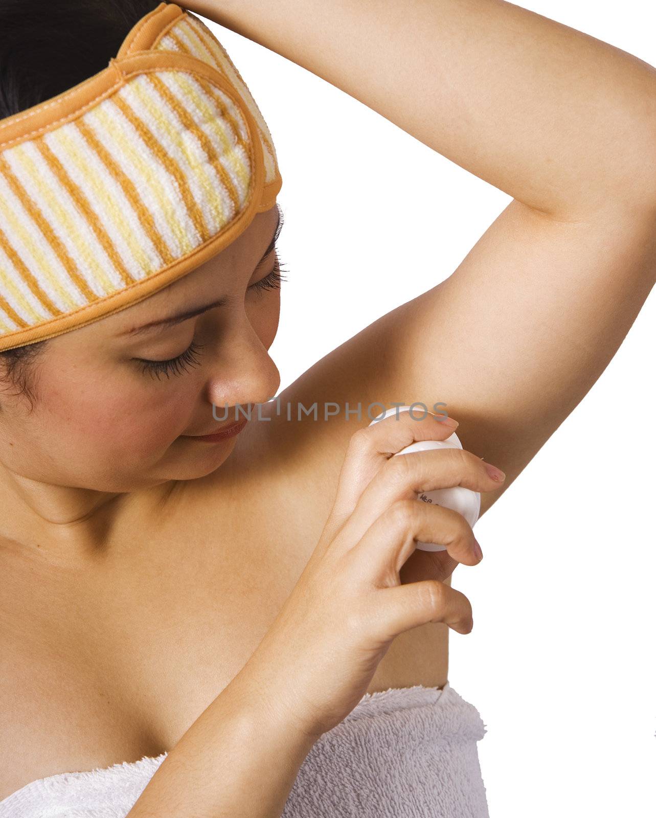 Woman Putting On Underarm Deodorant  by stuartmiles