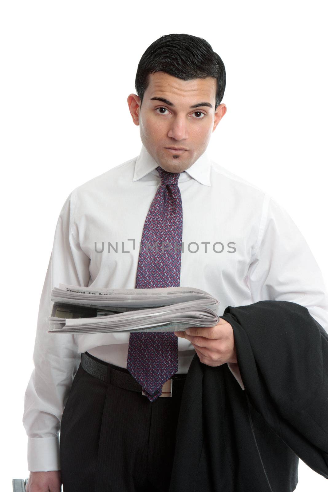 A businessman on the way to work holding the financial newspaper.  White background.