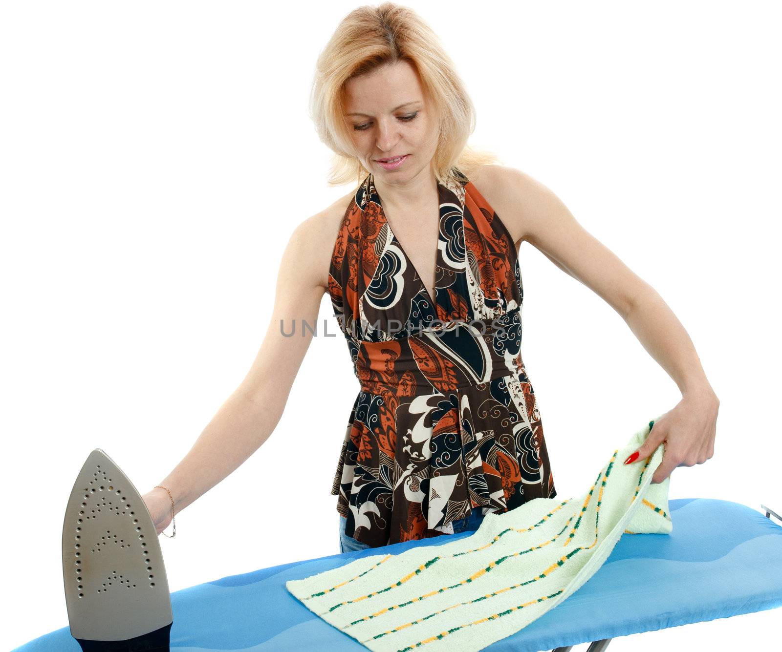 Beautiful housewife ironing the laundry on white background