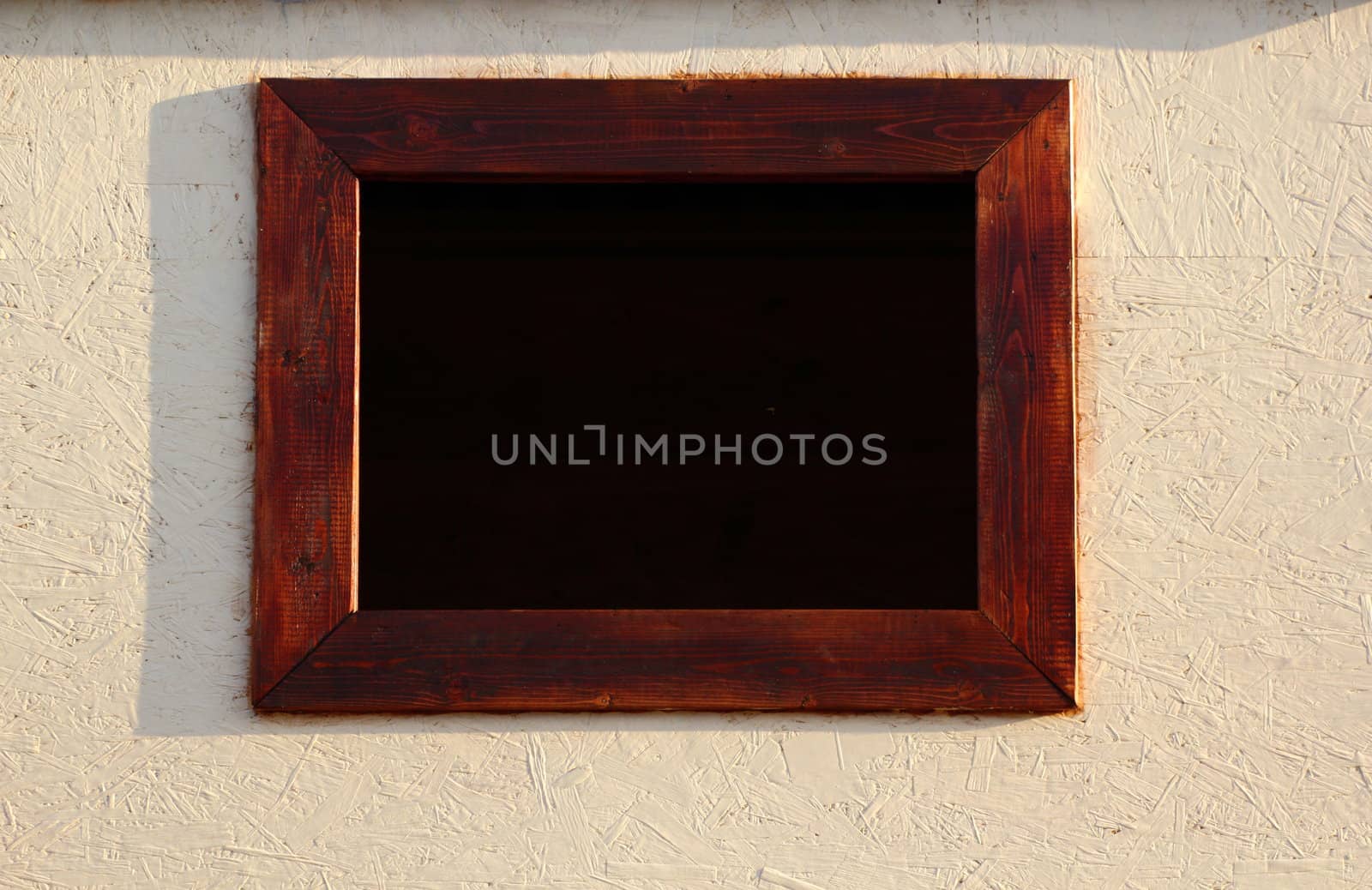 dark  window with brown frames at a wooden playing house for children