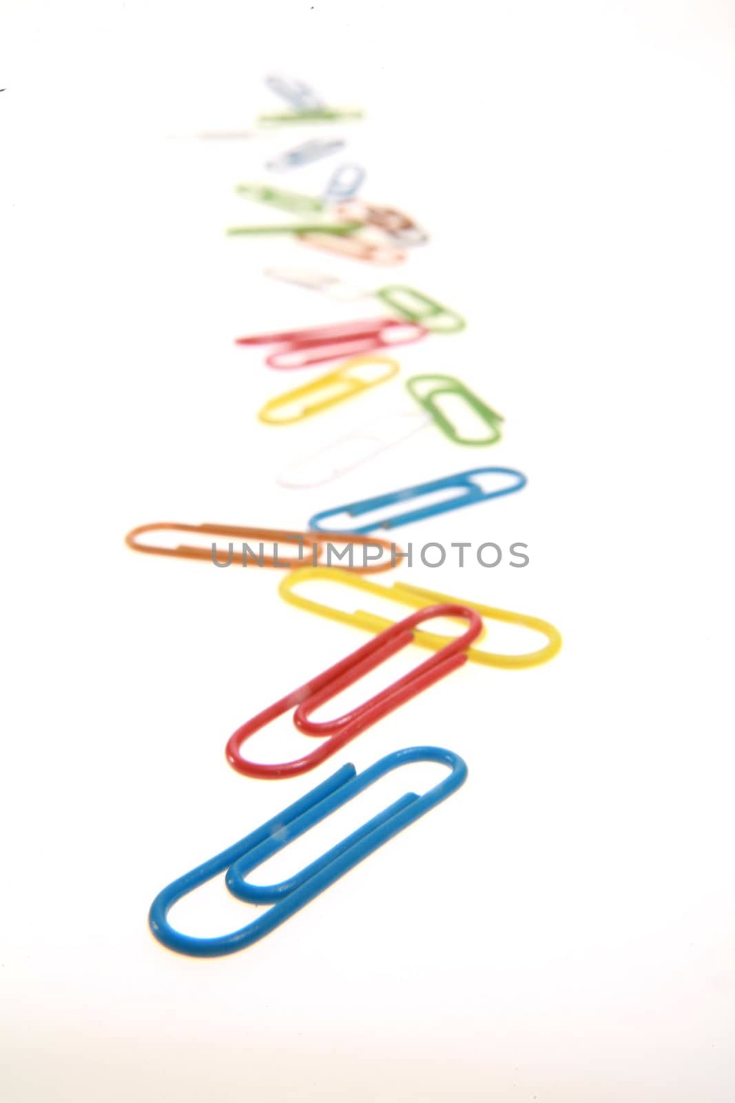 colorful paperclips on white