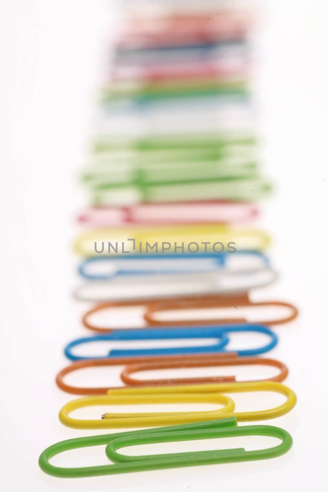 colorful paperclips on white