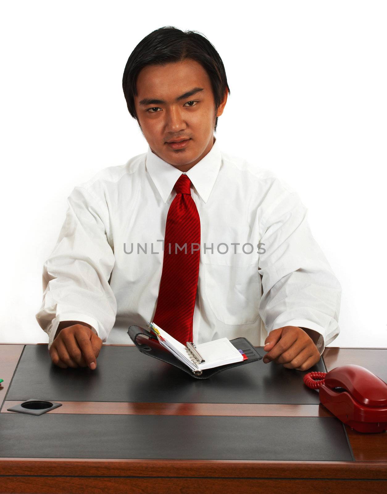 Office Worker Sitting At His Desk And Planning His Schedule For The Week