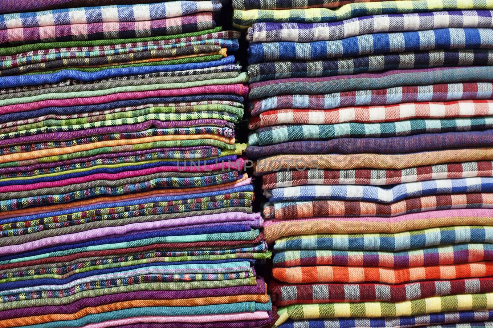 Multi colored towels pile background