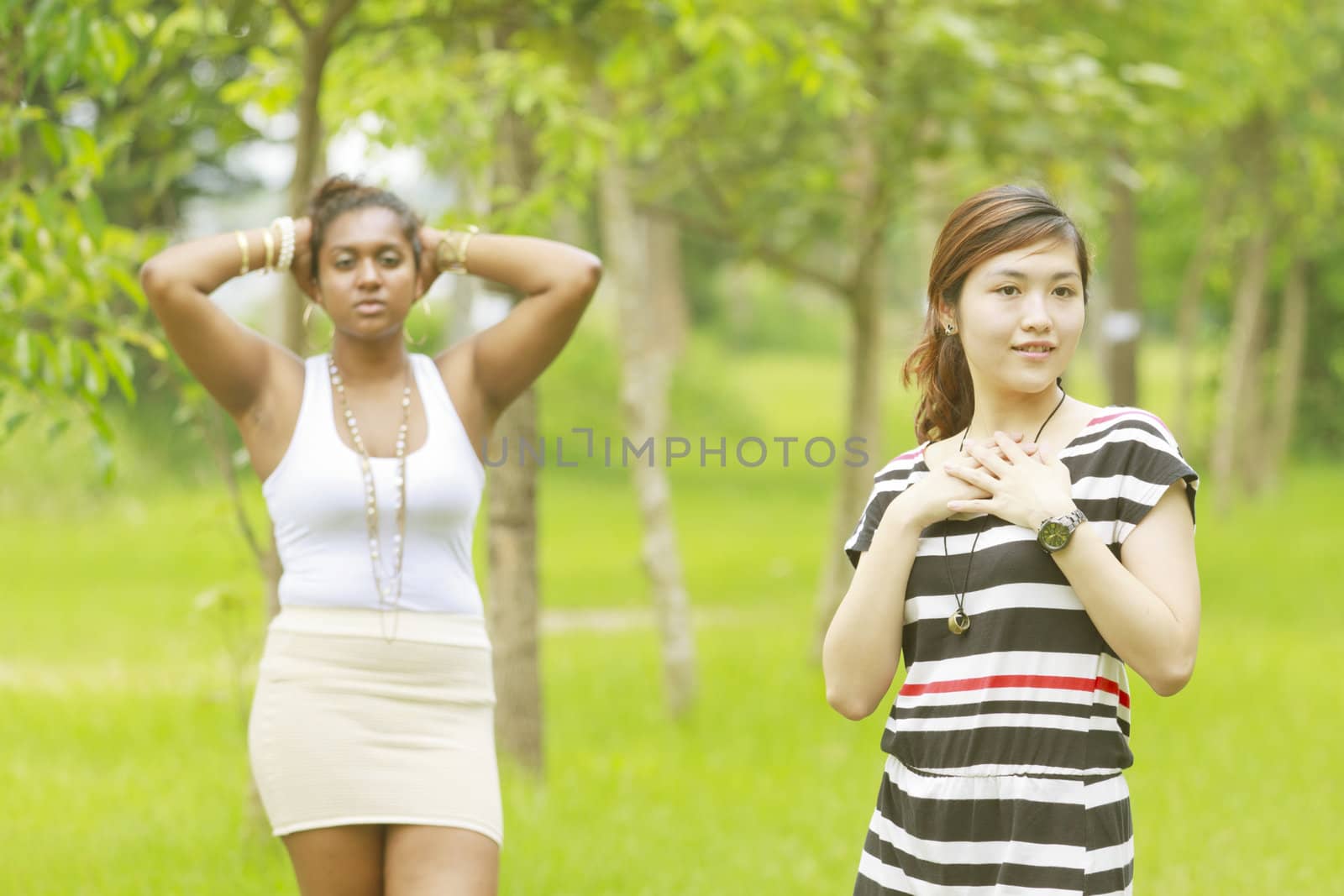 Two different races woman, black and asian. by kawing921