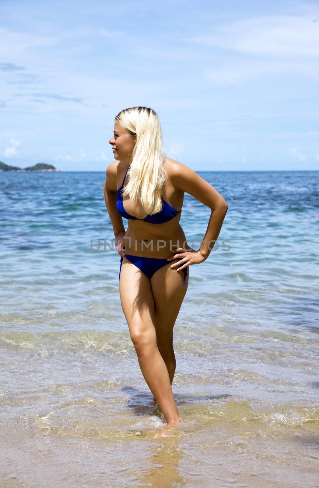 Attractive blonde playing on the beach. Thailand. Phuket