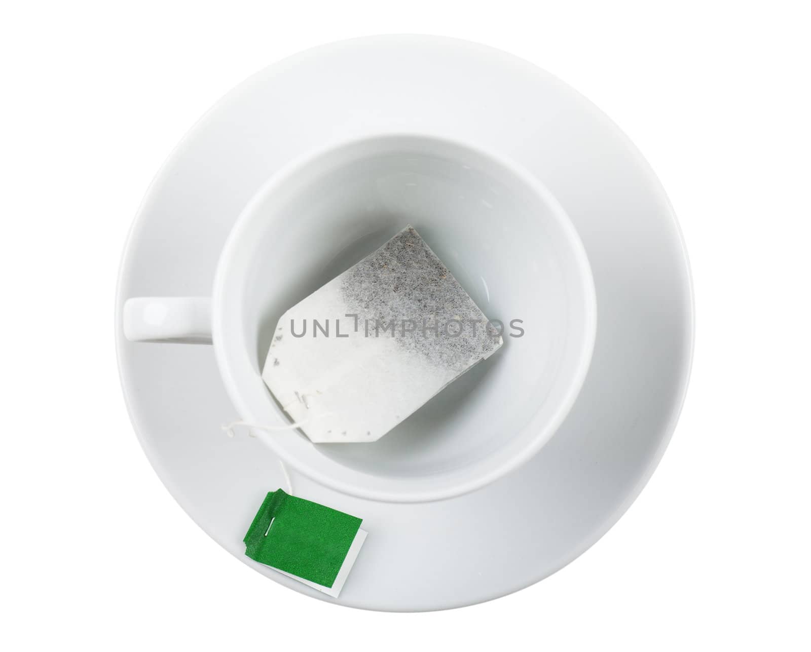 Top view of white cup with teabag over white background