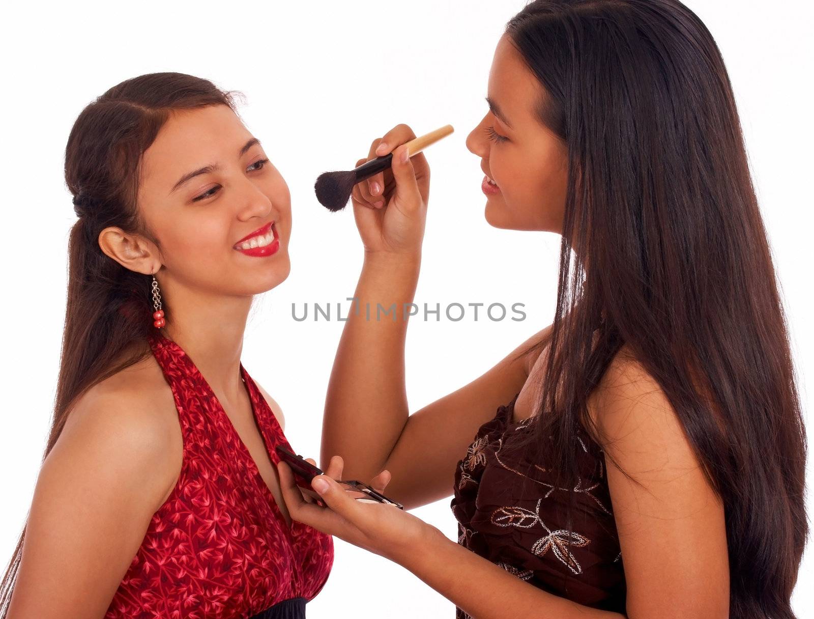 Girl Giving Her Friend A Make Over by stuartmiles