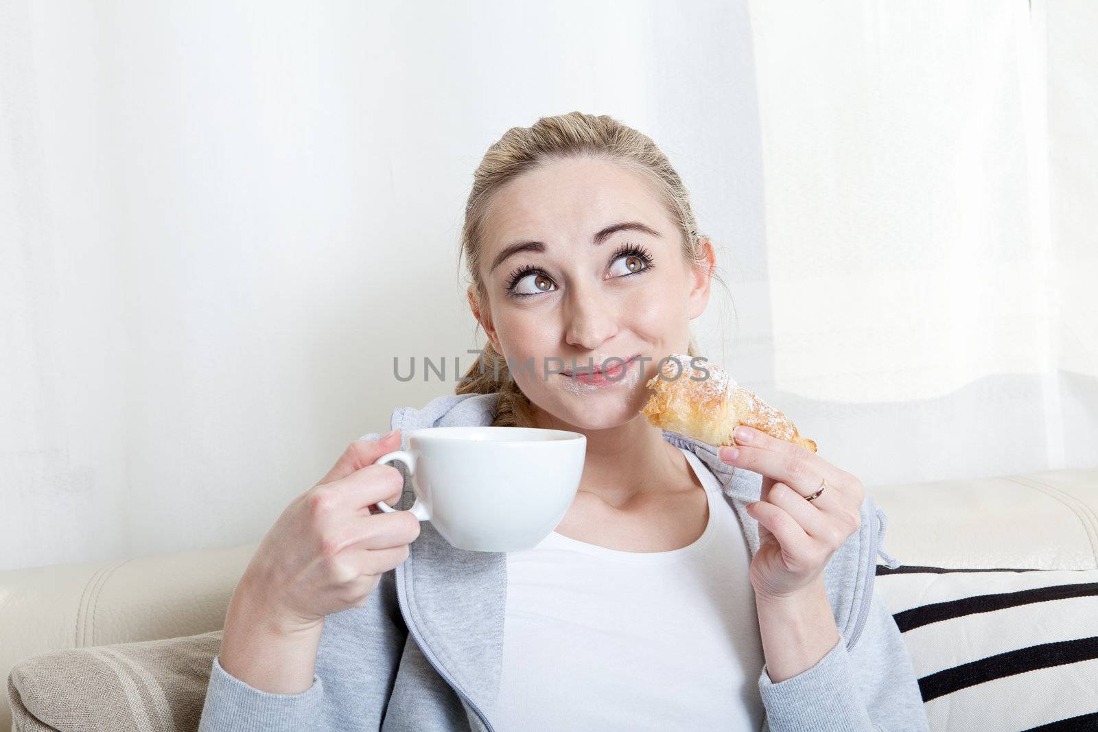 beautiful woman relaxing on couch with cup of coffe 