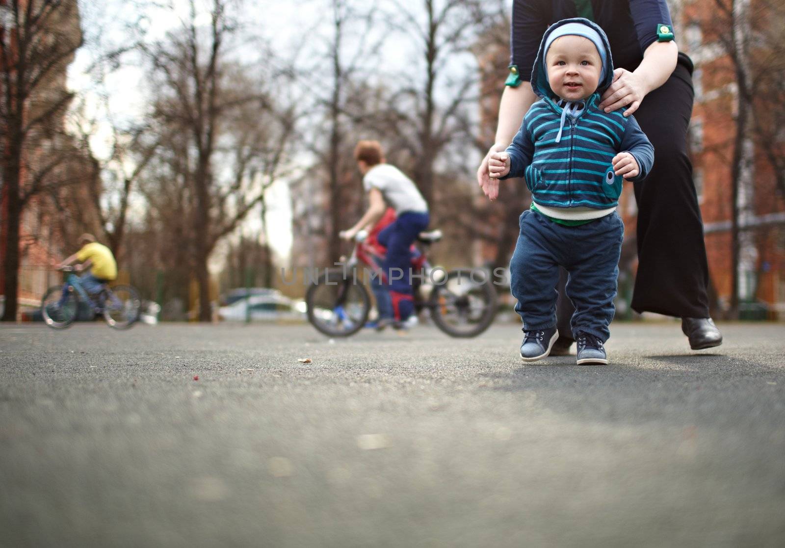 The first steps of the kid. Natural colors, shallow dof.