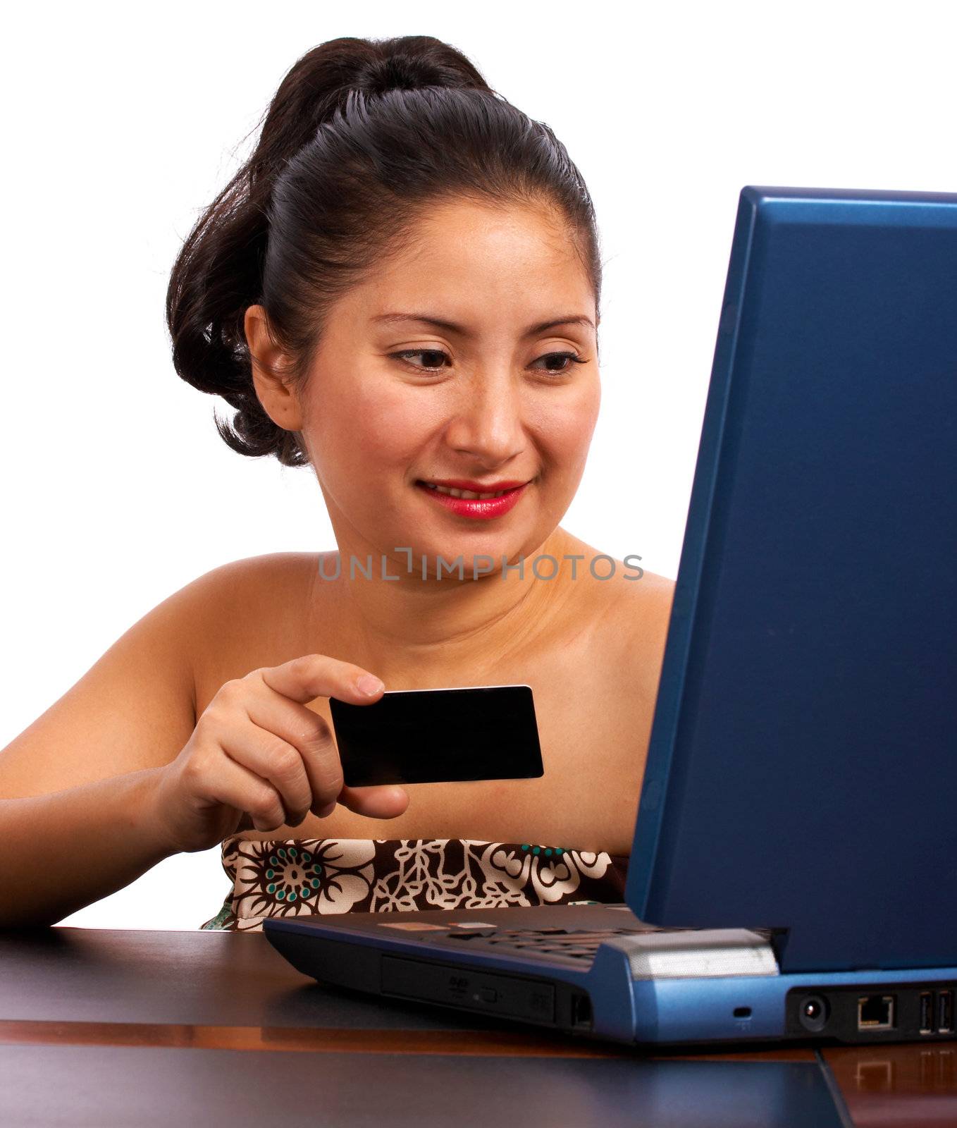 Customer Using A Credit Card To Buy On Her Computer by stuartmiles