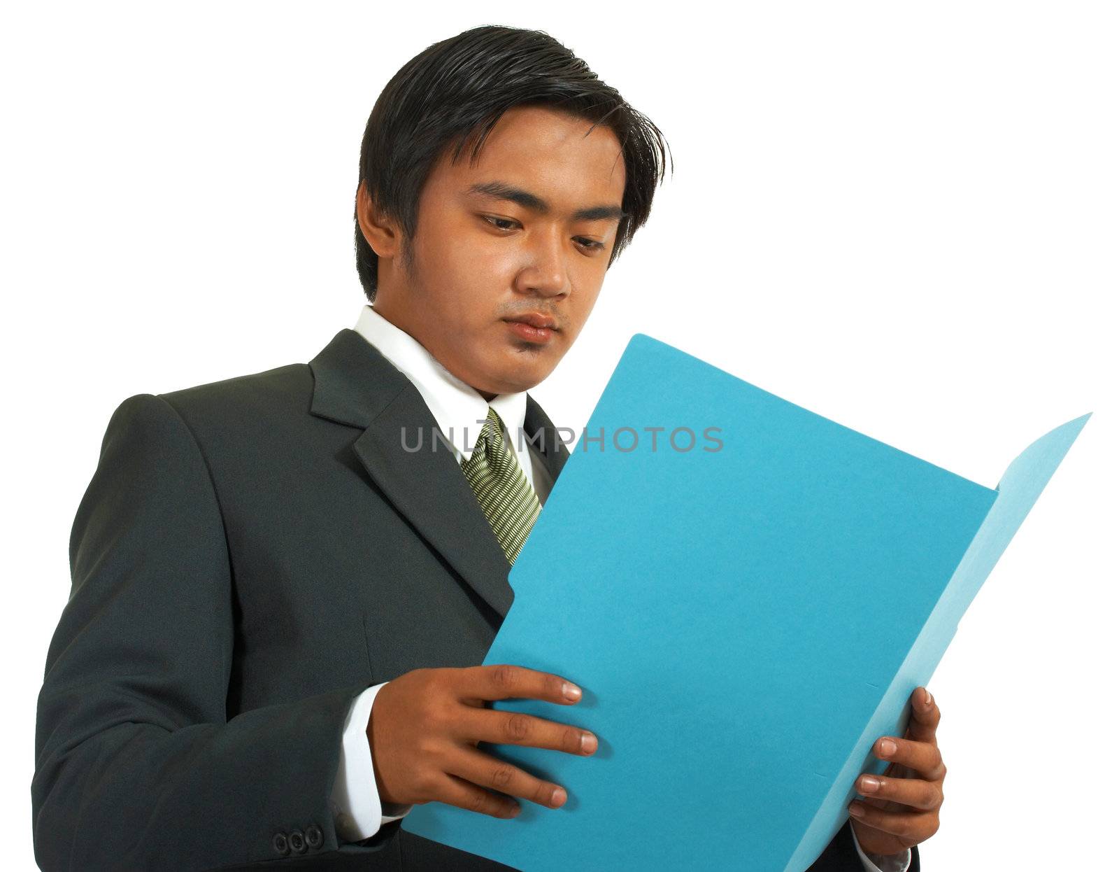 Businessman Reviewing A Document And A Folder