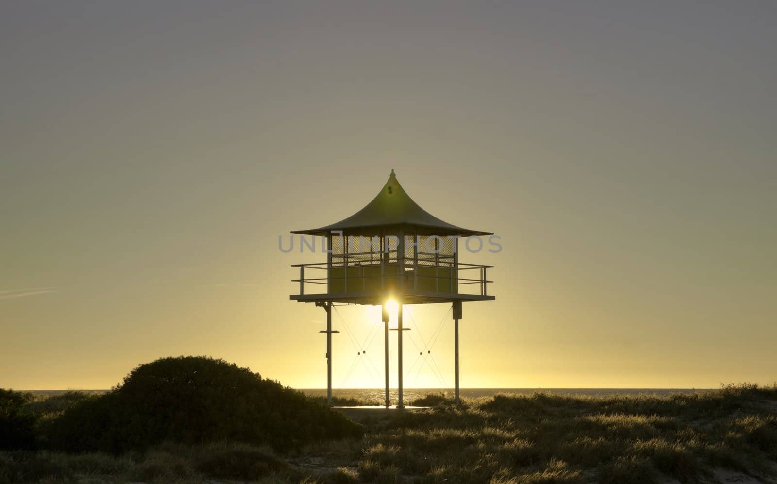 sunset behind surf life savers rescue lookout station